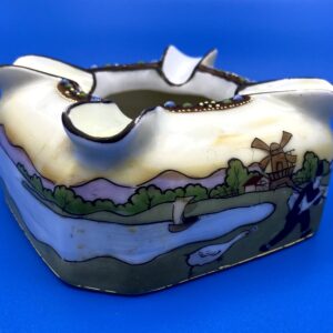 Great vintage porcelain ashtray with wraparound scene