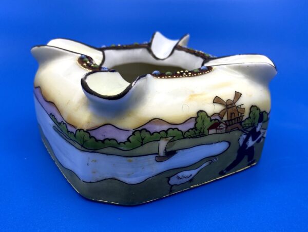 Great vintage porcelain ashtray with wraparound scene