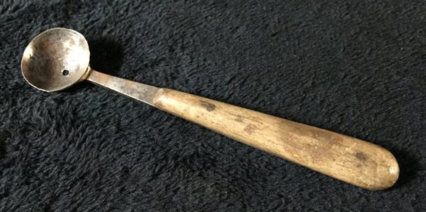 Vintage cocktail / bar spoon with hole. Wooden handle.